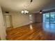 Living room with wood floors and access to a patio at 2750 E Bay Dr # 1E, Largo, FL 33771