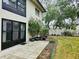 Condo back patio with plants and grassy area at 2750 E Bay Dr # 1E, Largo, FL 33771