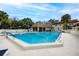 Sparkling community pool area with surrounding patio at 2750 E Bay Dr # 1E, Largo, FL 33771