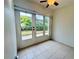 Bright sunroom with tiled floor and access to backyard at 2750 E Bay Dr # 1E, Largo, FL 33771