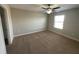 Spacious bedroom with carpeted floor and ceiling fan at 28489 Tranquil Lake Cir, Wesley Chapel, FL 33543