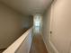 Upstairs hallway leading to bedrooms and bath at 28489 Tranquil Lake Cir, Wesley Chapel, FL 33543