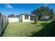 Large backyard with grassy area and a view of the home's exterior at 2930 49Th S Ter, St Petersburg, FL 33712