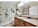 Bathroom with double sinks, granite countertops, and a shower/tub combo at 2930 49Th S Ter, St Petersburg, FL 33712