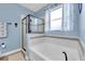 Relaxing bathroom with a soaking tub and a separate shower at 2930 49Th S Ter, St Petersburg, FL 33712