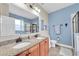 Bathroom features double sinks, granite countertops, and a large mirror at 2930 49Th S Ter, St Petersburg, FL 33712