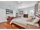 Main bedroom with hardwood floors, a large bed, and ample closet space at 2930 49Th S Ter, St Petersburg, FL 33712