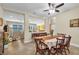 Open dining room with a wooden table and view into the living area at 2930 49Th S Ter, St Petersburg, FL 33712