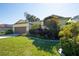 House exterior with a two-car garage and lush landscaping at 2930 49Th S Ter, St Petersburg, FL 33712