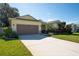 House exterior showcasing a two-car garage and well-maintained landscaping at 2930 49Th S Ter, St Petersburg, FL 33712