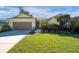 Single-story home with a two-car garage and landscaped front yard at 2930 49Th S Ter, St Petersburg, FL 33712