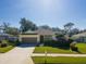 House exterior featuring a two-car garage and landscaped yard at 2930 49Th S Ter, St Petersburg, FL 33712