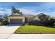 House exterior showcasing a well-manicured lawn and driveway at 2930 49Th S Ter, St Petersburg, FL 33712