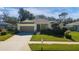 Single-story house with a two-car garage and well-maintained lawn at 2930 49Th S Ter, St Petersburg, FL 33712