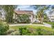 Stunning waterfront home with manicured landscaping and private walkway at 314 Shore E Dr, Oldsmar, FL 34677