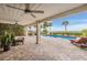 Relaxing pool area with patio furniture and stunning water views at 314 Shore E Dr, Oldsmar, FL 34677