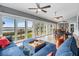 Relaxing sunroom featuring water views and comfortable seating at 314 Shore E Dr, Oldsmar, FL 34677