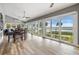 Sunroom with water views and sliding glass doors at 314 Shore E Dr, Oldsmar, FL 34677