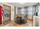 Small dining area with wooden table and chairs near the kitchen at 3303 Bainbridge Dr, Holiday, FL 34691