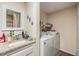 Convenient laundry room with washer, dryer, and storage at 3303 Bainbridge Dr, Holiday, FL 34691