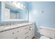 Clean bathroom with white vanity, granite countertop, and shower at 3510 Dellefield St, New Port Richey, FL 34655