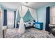 Charming bedroom with canopy bed, light blue walls, and ample natural light at 3510 Dellefield St, New Port Richey, FL 34655