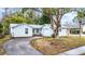 Cute light blue house with a one car garage and small front yard at 3510 Dellefield St, New Port Richey, FL 34655