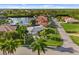 Aerial view of single Gathering home with lush landscaping at 3560 Tripoli Blvd, Punta Gorda, FL 33950