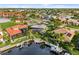 Drone view of waterfront property with private dock and boat at 3560 Tripoli Blvd, Punta Gorda, FL 33950