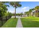 Landscaped backyard with brick pavers leading to the canal at 3560 Tripoli Blvd, Punta Gorda, FL 33950