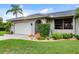 House exterior with a white garage door at 3560 Tripoli Blvd, Punta Gorda, FL 33950