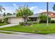 Single-story home with attached garage and lush landscaping at 3560 Tripoli Blvd, Punta Gorda, FL 33950