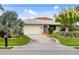 House exterior with a terracotta roof and landscaping at 3560 Tripoli Blvd, Punta Gorda, FL 33950