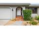 Home's entrance with tiled steps and landscaping at 3560 Tripoli Blvd, Punta Gorda, FL 33950