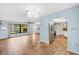 Bright living room with tile floors and view to kitchen at 3560 Tripoli Blvd, Punta Gorda, FL 33950