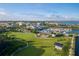 Aerial view of a waterfront park with walking paths and solar panels at 3560 Tripoli Blvd, Punta Gorda, FL 33950