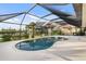 Kidney-shaped pool with screened enclosure at 3560 Tripoli Blvd, Punta Gorda, FL 33950