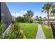 Side yard with a walkway leading to the water at 3560 Tripoli Blvd, Punta Gorda, FL 33950