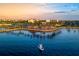 Boat on calm water near a waterfront restaurant and hotel at 3560 Tripoli Blvd, Punta Gorda, FL 33950