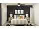 Bedroom with a white upholstered bed, nightstands, and black accent wall at 3632 Forest Path Dr, Plant City, FL 33565