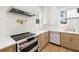 A modern kitchen design featuring white countertops and stainless steel appliances, and a pot filler faucet at 3640 15Th N St, St Petersburg, FL 33704