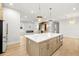 A kitchen island featuring white countertops, wood cabinets, and stainless steel appliances at 3640 15Th N St, St Petersburg, FL 33704