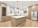 Bright kitchen featuring a large island with a white countertop and stainless steel appliances and wooden cabinetry at 3640 15Th N St, St Petersburg, FL 33704