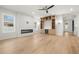 Open concept living room featuring a modern fireplace, built-in shelving, and ample natural light at 3640 15Th N St, St Petersburg, FL 33704