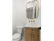 Chic powder room featuring a marble countertop, a modern gold mirror, and stylish fixtures at 3640 15Th N St, St Petersburg, FL 33704