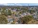 Aerial view of a residential neighborhood showcasing a variety of homes and tree-lined streets at 37620 Howard Ave, Dade City, FL 33525