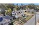 Aerial view of a home showcasing a large yard, landscaping, and solar panels at 37620 Howard Ave, Dade City, FL 33525