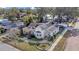 Aerial view of a house with a spacious yard and solar panels on the roof at 37620 Howard Ave, Dade City, FL 33525