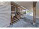 Wooden steps leading to a screened porch at 37620 Howard Ave, Dade City, FL 33525