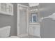 Bathroom with shower stall, vanity sink, and grab bar at 37620 Howard Ave, Dade City, FL 33525